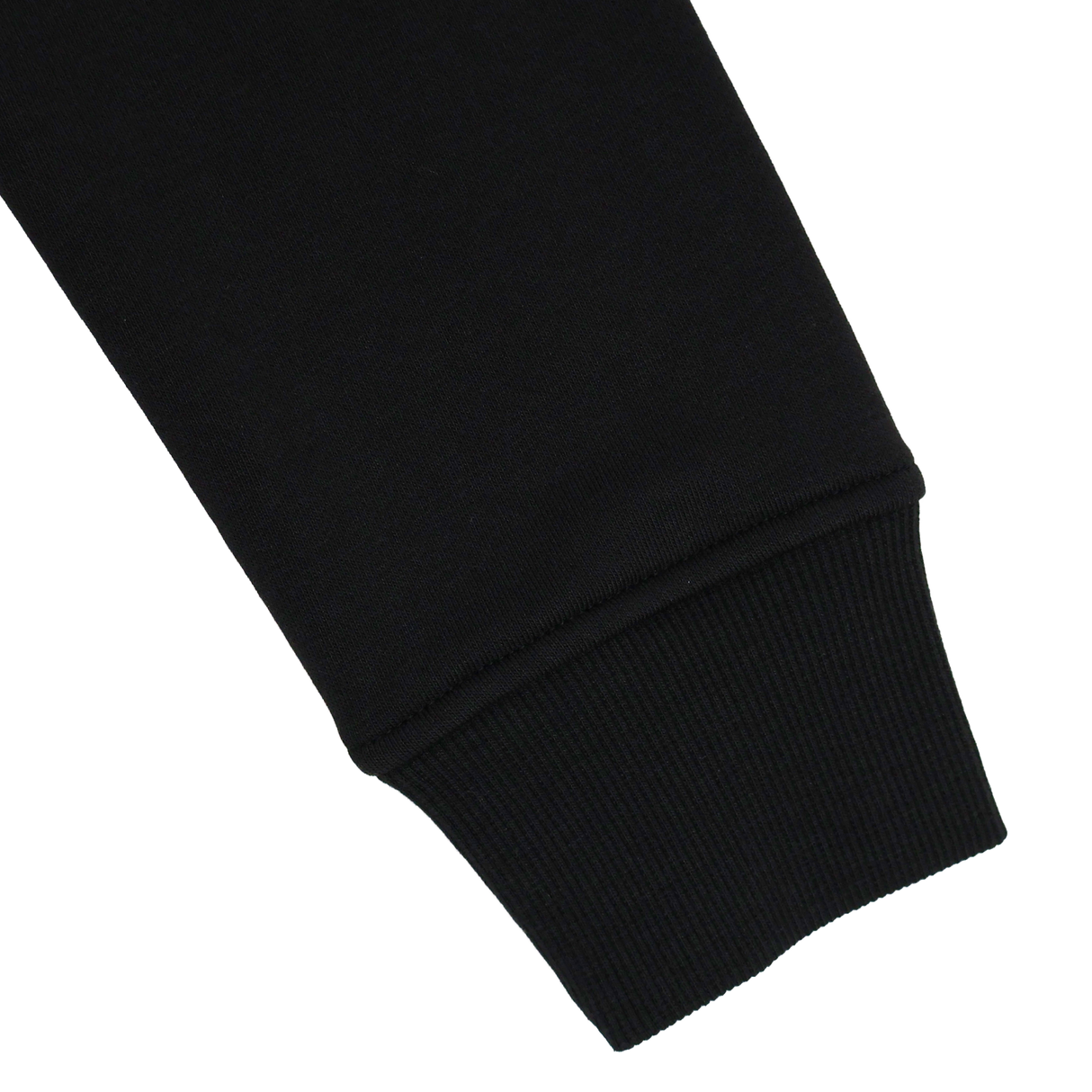 Close-up of the Canterbury Youth Uglies Logo Hoodie’s black sleeve with ribbed cuff, set against a plain white background to highlight the classic rugby-inspired style from Canterbury.
