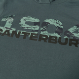 A teal shirt featuring "1904" in a green camo pattern and "CANTERBURY" in bold black below, perfect to pair with your Canterbury FORCE HOODIE.