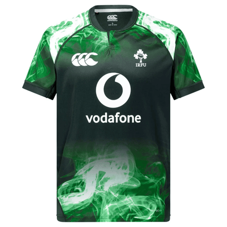 The Limited Edition Ireland "Chicago" Pro Pre-Game Jersey by Canterbury features VapoDri technology, a bold green smoke pattern on the lower half and shoulders, plus white Canterbury, Vodafone, and IRFU logos.