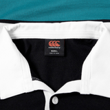 Close-up of the Canterbury Uglies Short Sleeve Classic Rugby Jersey by Canterbury, showing its white collar, black body, and size L label—crafted from heavyweight cotton for durable comfort.