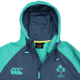 The Ireland 26/27 Summer Tour Training Hoodie by Canterbury features IRFU shamrock and CCC logos, a teal and navy design, flat lay with hood up and partial zip—ideal as a moisture-wicking training hoodie for the Ireland Summer Tour.