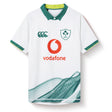 The Ireland 26 Alternate Test Jersey by Canterbury features a stylish green collar, IRFU and Canterbury branding, a Vodafone sponsor logo, and an eye-catching abstract green wave design at the hem. Designed for both comfort and durability, this performance rugby jersey is perfect for passionate fans.