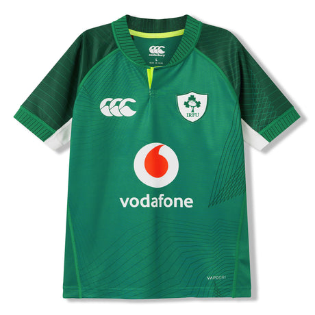 The Ireland 26 Home Pro Jersey by Canterbury showcases bold white, green, and yellow accents and features the iconic IRFU crest, the Vodafone sponsor logo, and the Canterbury brand logo prominently on the front.