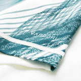 Close-up of white fabric with green abstract lines and the word “VAPODRI” printed near the stitched edge, highlighting the premium detailing of the Ireland 26 Alternate Pro Jersey by Canterbury.
