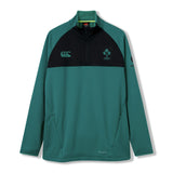The Ireland 26 1/4 Zip Training Top by Canterbury is a green and black long-sleeve pullover featuring Thermoreg technology, convenient zip pockets, official Ireland rugby and Canterbury logos, and classic quarter-zip styling.