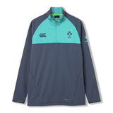 The Ireland 26 1/4 Zip Training Top by Canterbury is a long-sleeve pullover with a half-zip design, teal shoulder panels, and logo accents on a dark gray base. Featuring convenient pockets, a high collar, and advanced Thermoreg technology for warmth and comfort, this training top is designed to support your performance during every rugby session.