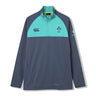 The Ireland 26 1/4 Zip Training Top by Canterbury is a long-sleeve pullover with a half-zip design, teal shoulder panels, and logo accents on a dark gray base. Featuring convenient pockets, a high collar, and advanced Thermoreg technology for warmth and comfort, this training top is designed to support your performance during every rugby session.