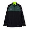 The Ireland 26 1/4 Zip Training Top by Canterbury features a black and dark green design with a quarter-zip front, IRFU and Canterbury logos, a neon green inner collar, and a Vodafone logo on the sleeve. Crafted with Thermoreg technology to regulate your body temperature during intense sessions, this rugby training top combines performance and style.