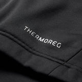 Close-up of black fabric with white embroidered “THERMOREG” text and visible seam detailing, highlighting the advanced Thermoreg technology featured in the Ireland 26 1/4 Zip Training Top by Canterbury.