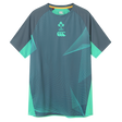 The Ireland 26/27 Summer Tour Superlight Training Tee by Canterbury features short sleeves, teal and gray geometric patterns, the IRFU crest, and the Canterbury Superlight logo on the chest.
