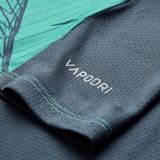 Close-up of the textured gray and teal fabric from the Canterbury Ireland 26/27 Summer Tour Superlight Training Tank, featuring "VAPODRI" in white lettering.