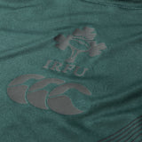 Close-up of a green Ireland 26 Training Tank by Canterbury AW26, featuring the IRFU logo with a rugby ball and shamrock leaves, along with the Canterbury brand logo beneath it; this training tank is crafted for comfort and performance in every session.