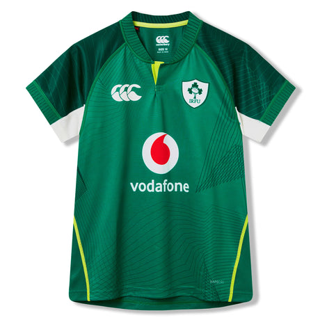 The Youth Ireland 26 Home Pro Jersey by Canterbury is an official rugby jersey for young fans, featuring a green design with white and yellow accents. The front displays the IRFU logo, Canterbury branding, and Vodafone sponsor, combining high-quality construction with authentic team details from Canterbury.