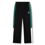 Women’s Ireland 26 Legends Fleece Pant by Canterbury features black track pants with green and white side panels, an elastic waistband, and a small white embroidered Canterbury logo on the left thigh, inspired by classic Women’s Ireland Rugby pants.