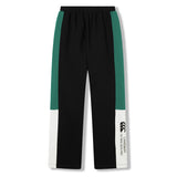 The Women’s Ireland 26 Legends Fleece Pant by Canterbury features black fabric with green and white side panels, an elastic waistband, and a branded logo with text on the lower left leg—offering both comfort and style for fans of Ireland Rugby.