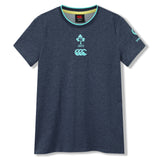 The Women’s Ireland 26 Cotton T-shirt by Canterbury is a navy blue short-sleeve women’s cotton rugby shirt featuring IRFU and Canterbury logos on the chest and a turquoise “Vodafone” logo on the left sleeve, shown against a white background.