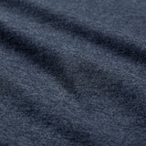 Close-up of dark gray heathered fabric from the Women’s Ireland 26 Cotton T-shirt by Canterbury, with visible texture and soft folds running diagonally across the surface.