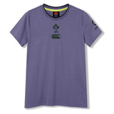 The Women’s Ireland 26 Cotton T-shirt by Canterbury is a purple short-sleeve cotton t-shirt for women, featuring the Ireland Rugby Football Union and Canterbury logos on the chest and sleeve, displayed laid flat on a white background.