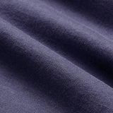 Close-up of a purple fabric with a soft, smooth texture and visible horizontal folds, reflecting the premium quality of the Women’s Ireland 26 Cotton T-shirt by Canterbury.