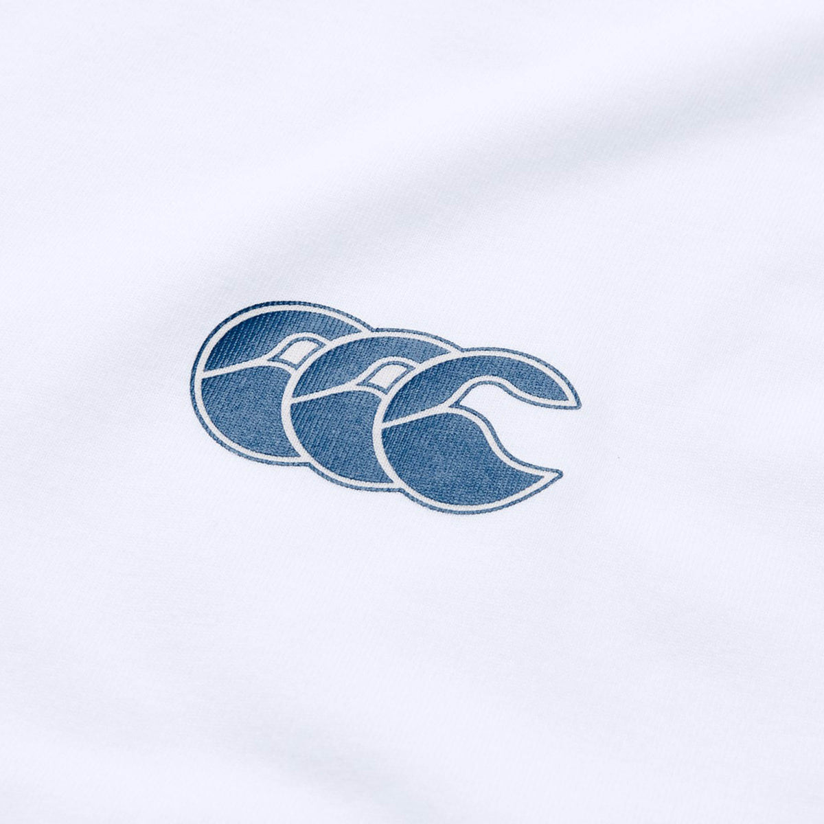 Introducing the Canterbury Tempo+ GFX Training Tank: a lightweight white workout tank featuring Canterbury’s signature blue triple crescent logo—ideal for your next rugby training session.