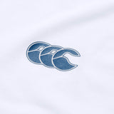 Introducing the Canterbury Tempo+ GFX Training Tank: a lightweight white workout tank featuring Canterbury’s signature blue triple crescent logo—ideal for your next rugby training session.