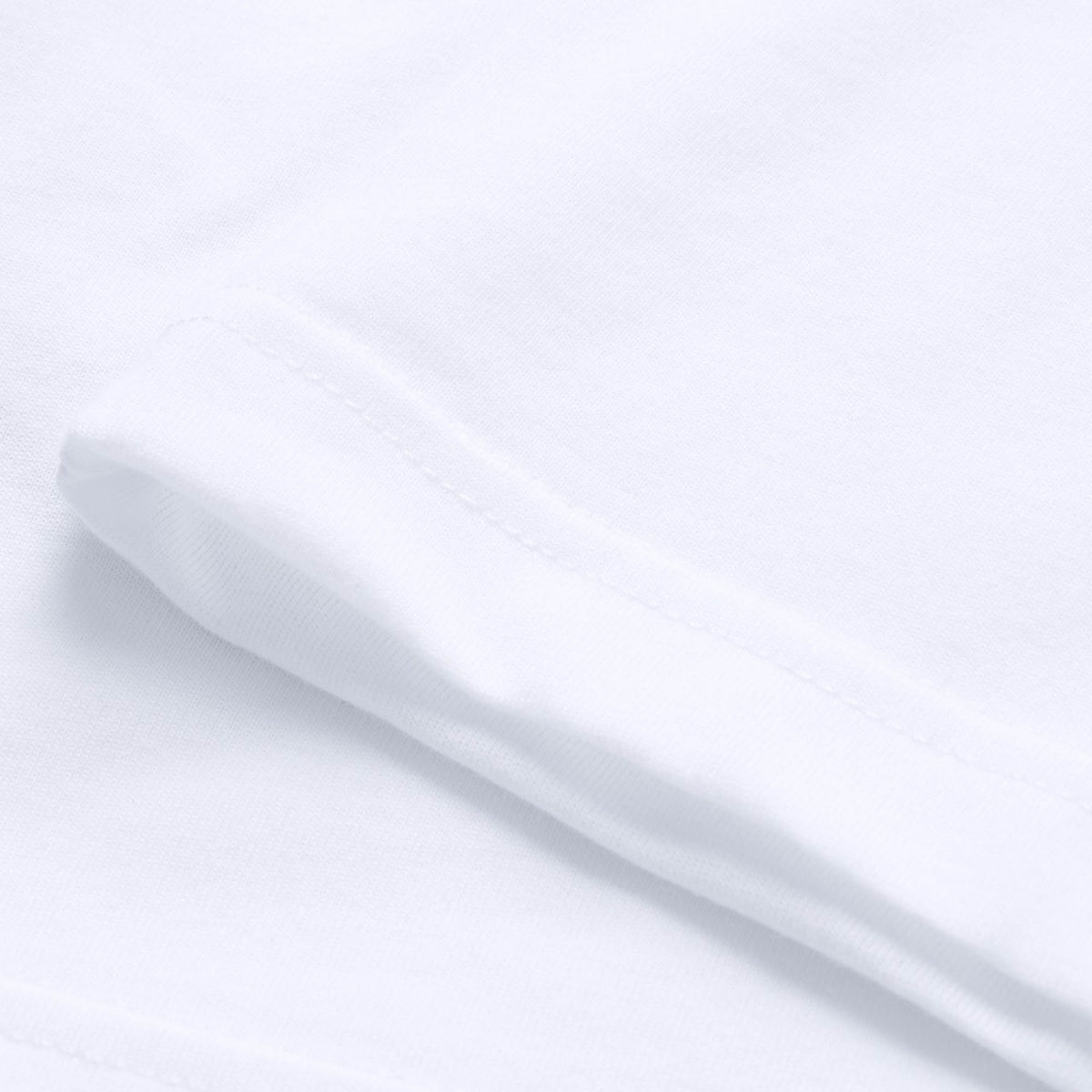 Close-up view of the sleeve and hem of the Canterbury Tempo+ GFX Training Tank by Canterbury, highlighting the fabric texture and stitching details characteristic of lightweight workout tanks.