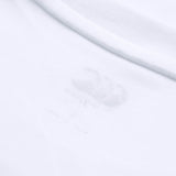 Close-up of the Canterbury Tempo+ GFX Training T-Shirt collar in white, highlighting a faint printed label inside the fabric near the neckline.