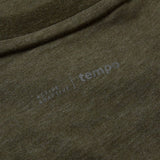 Close-up of an olive green Canterbury Tempo+ GFX Training T-Shirt fabric with faint printed text that reads “ACTIVE ADAPTIVE | tempo” near a seam, highlighting the quality and attention to detail in this Canterbury rugby training top.
