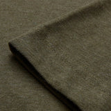 Close-up of a folded sleeve of the Canterbury Tempo+ GFX Training T-Shirt in olive green, highlighting the fabric texture and double-stitched seam.