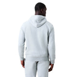 A man stands facing away from the camera, wearing a light gray Canterbury Rakaia 2.0 Hoodie and matching sweatpants against a plain white background.