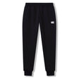The Rakaia 2.0 Fleece Pant by Canterbury is a black athletic jogger with an elastic waistband, ribbed cuffs, and a white embroidered Canterbury logo on the left thigh, shown against a plain white background.
