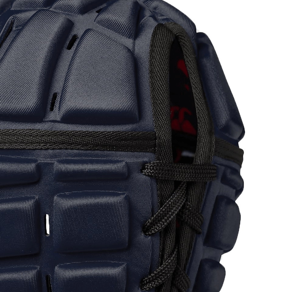 Close-up of a blue Canterbury Raze rugby headguard with black fastening straps.