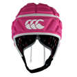 The Canterbury Raze LE Headguard by Canterbury is a pink rugby scrum cap featuring shock-absorbing padding and a standout white logo on the front.