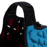 Close-up of a blue and black athletic shoe showcasing its tread and Canterbury branding velcro strap.