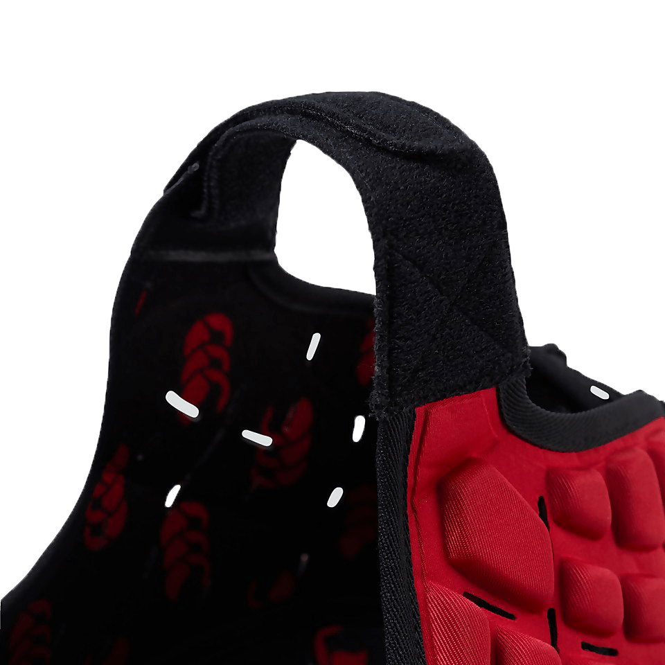 Close-up view of a black and red athletic shoe showing the heel padding and textured sole with Canterbury branding.