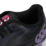 Close-up view of a Canterbury Phoenix Genesis Team FG - Black/Verbena sports shoe with a patterned Vaposkin design and a pink logo.