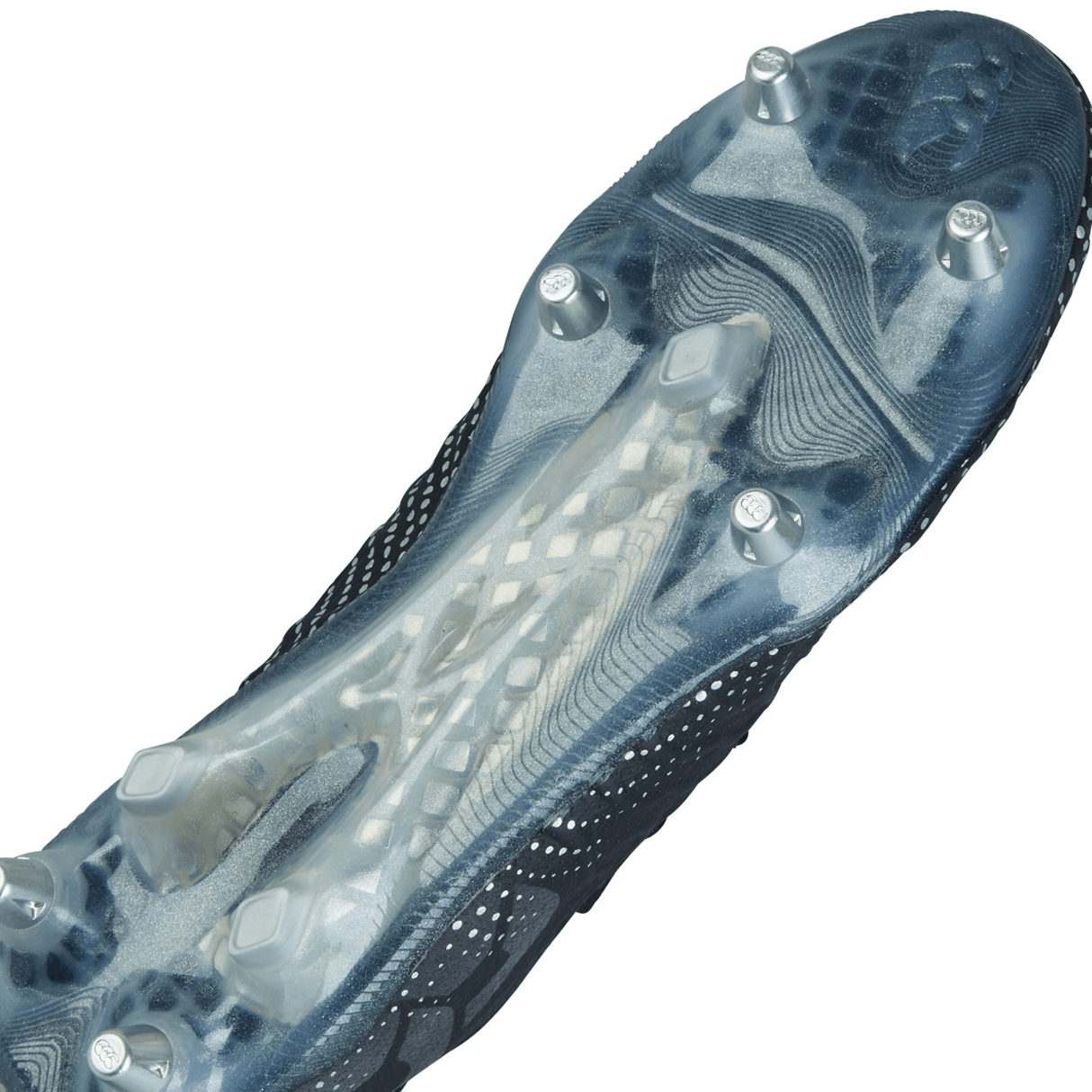 Close-up of the sole of Canterbury's Speed Infinite Elite SG - Black/Silver Metallic sports cleat, featuring metal studs for traction on the bottom surface.