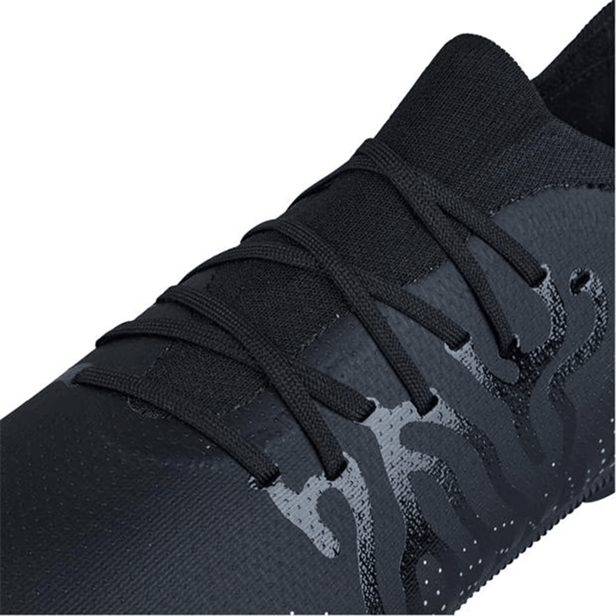 Close-up of a Canterbury Speed Infinite Pro SG athletic shoe in black/silver metallic, highlighting its textured design, lightweight construction, and matching laces.