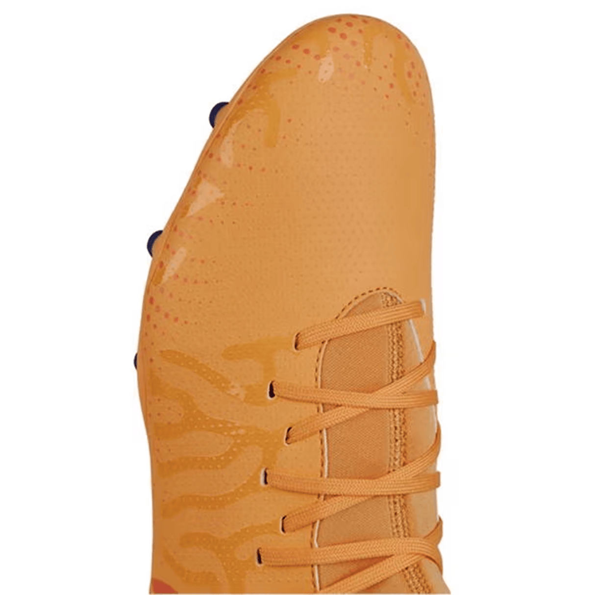 Close-up view of a Canterbury Speed Infinite Team FG soccer cleat in Amber Yellow, Orange Crush, and Mars Dust color scheme, featuring a textured surface, lightweight construction, orange laces, and orange and red accents on the toe area.