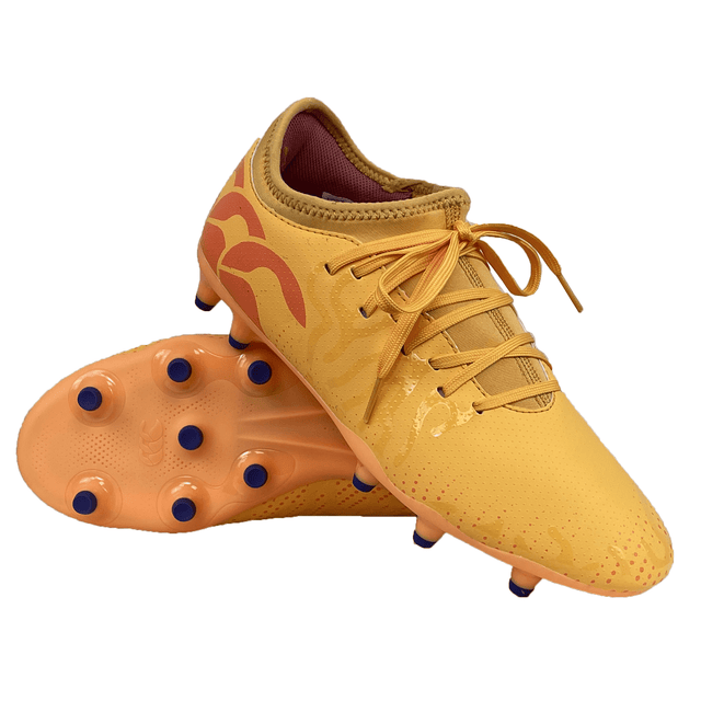 A pair of Canterbury Speed Infinite Team FG soccer cleats in Amber Yellow with Orange Crush accents and Mars Dust blue studs, featuring lightweight construction, laces, and a low-cut design. Perfect for the Speed Infinite Team FG collection.
