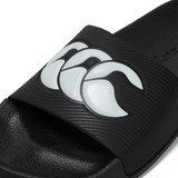 Close-up of the Canterbury Wide Fit Slide - Black sandal front portion, showcasing a white stylized wave pattern on the strap, designed by Canterbury for all-day comfort.