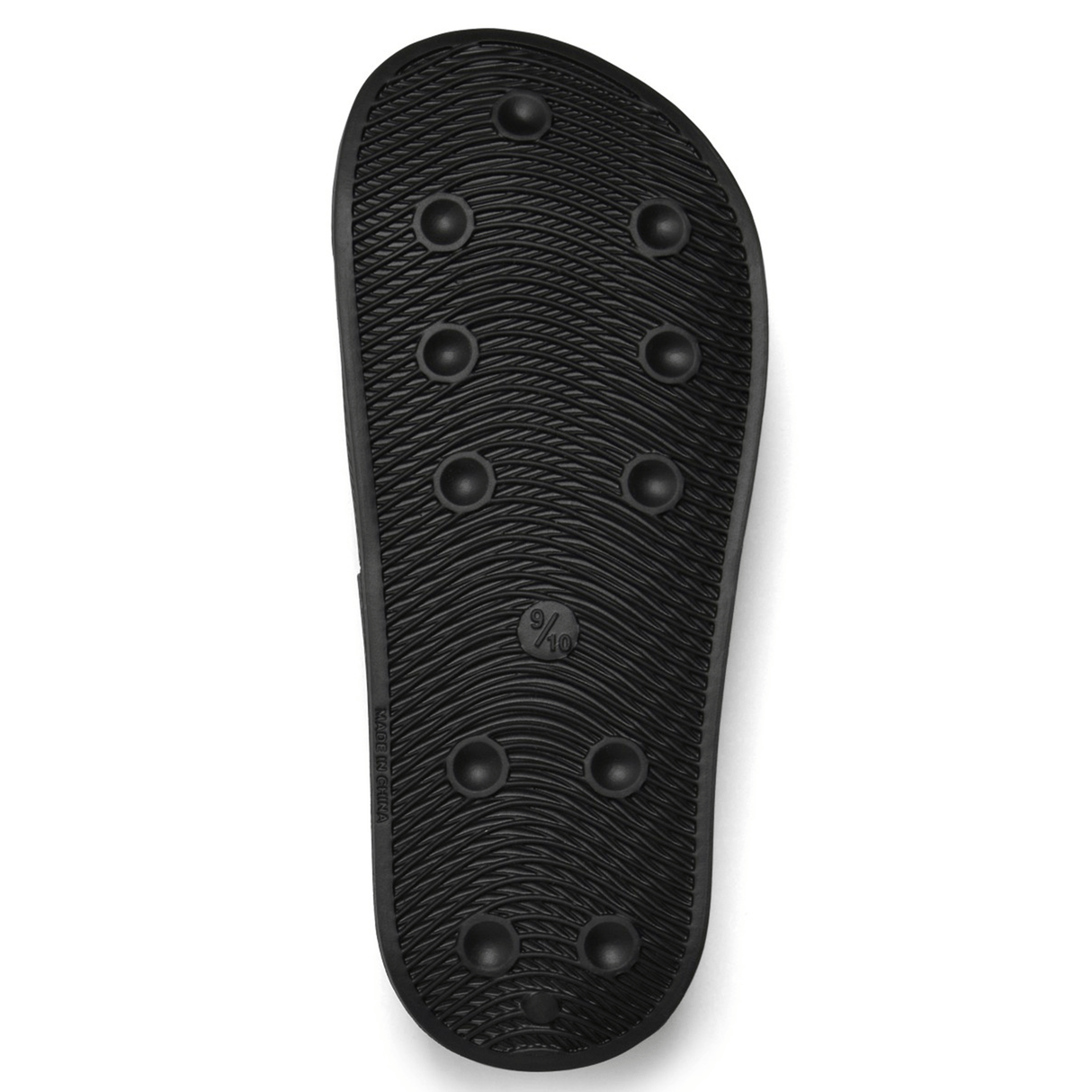 The image displays the bottom of the Canterbury Wide Fit Slide - Black, featuring several evenly spaced circular treads for grip and a size marking indicating 9/10, making it an ideal choice for all-day comfort.