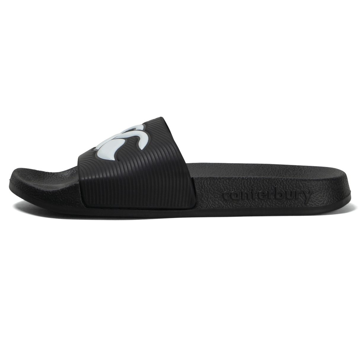 The Canterbury Wide Fit Slide - Black is a slide sandal featuring a white logo on the strap and the word "Canterbury" embossed on the side, with a textured sole for all-day comfort.