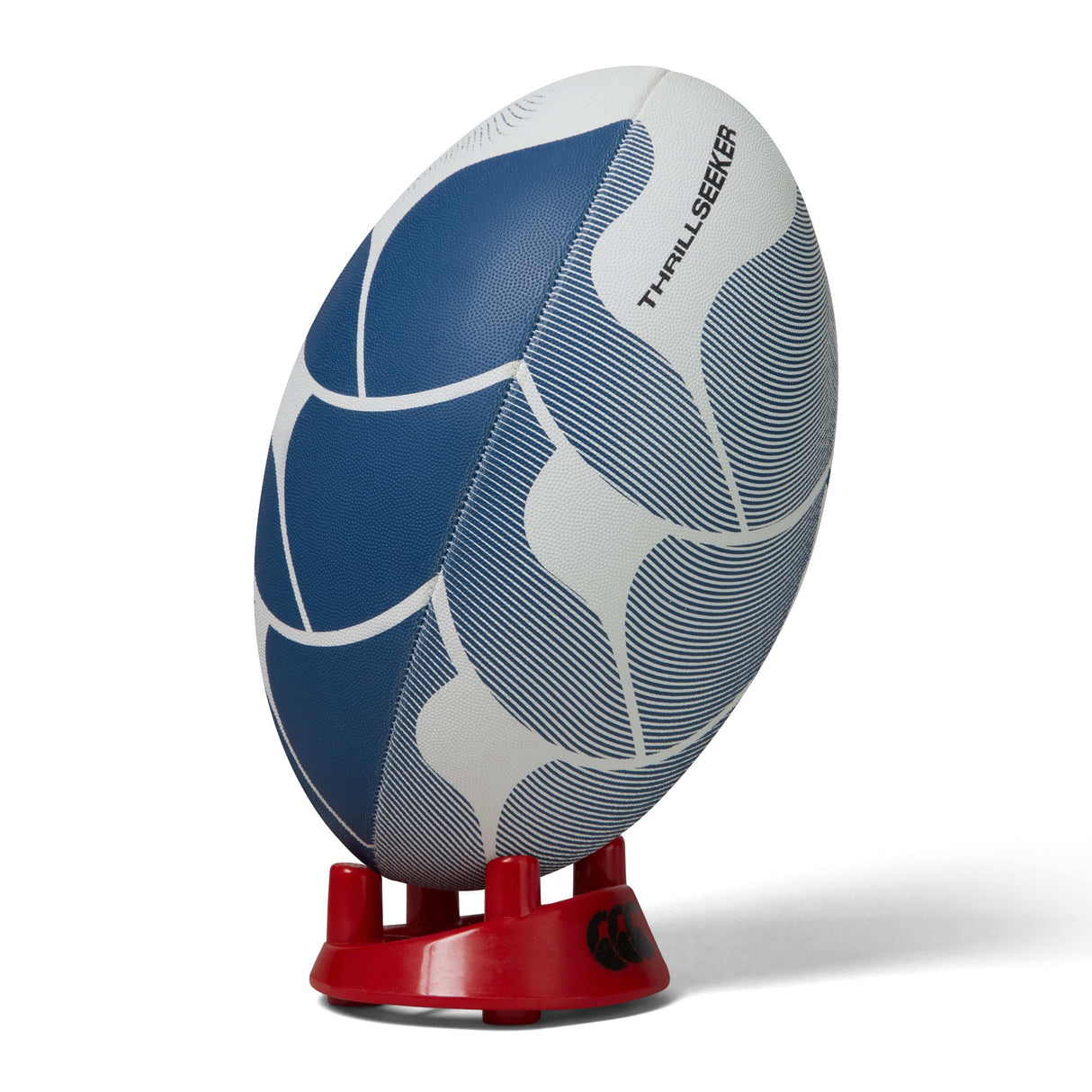 A blue and white patterned Canterbury Thrillseeker Play rugby ball on a red stand against a white background.