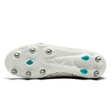 The underside of the Canterbury Stampede Groundbreak Pro SG AU-WHITE/BALTIC GREEN, a white cleat by Canterbury inspired by soft ground rugby boots, features eleven metal studs—two highlighted with Baltic Green accents—set against a plain white background.