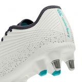Close-up of the heel of the Canterbury Stampede Groundbreak Pro SG rugby boot in AU-WHITE/BALTIC GREEN, featuring metal studs, black trim, teal accents, and the Canterbury logo and branding on the back—engineered as premium scrum specialist boots for forwards seeking reliable soft ground performance.