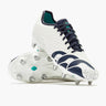 The Canterbury Stampede Groundbreak Pro SG AU-WHITE/BALTIC GREEN rugby boots by Canterbury, featuring a white base with Baltic green accents, metal studs, and a speckled design, are displayed on a plain background—these premium soft ground boots deliver the grip and support needed for scrum specialists.