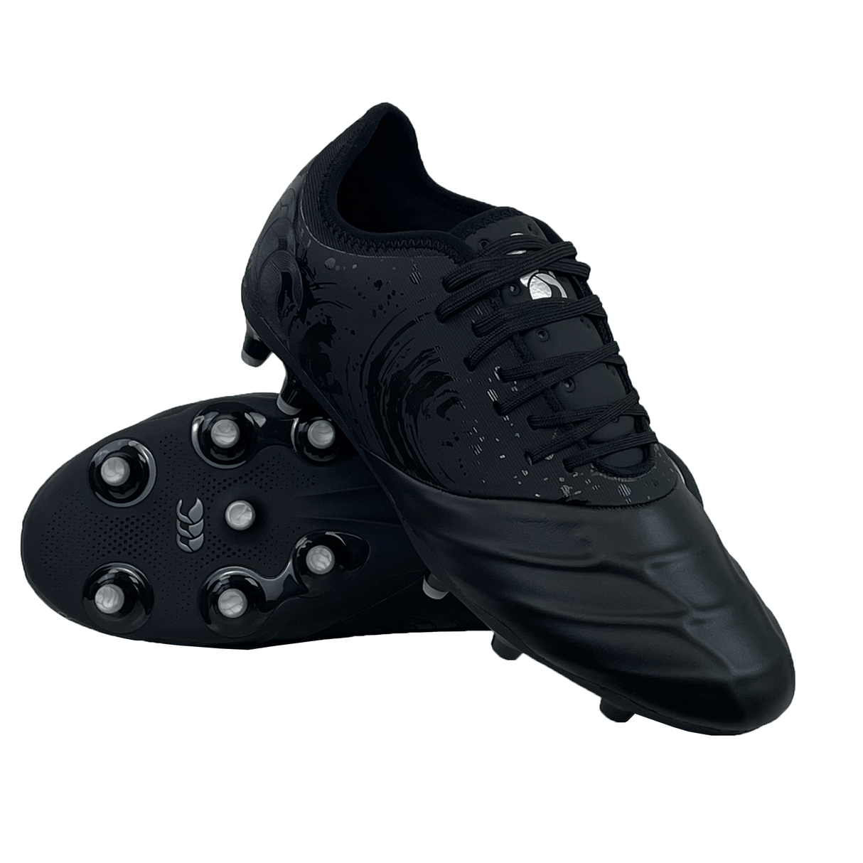 A pair of Canterbury Phoenix Genesis Pro FG - Black/Silver Metallic soccer cleats, one placed on top of the other, featuring a textured pattern, multiple studs on the sole, and a TPU-reinforced mesh for enhanced durability.