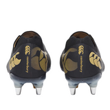 A pair of Canterbury Phoenix 2.0 Elite SG rugby boots in black with gold accents and metal studs, shown from the back on a plain background.