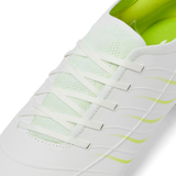 Close-up of the Canterbury Phoenix 2.0 Pro SG rugby boot in Snow White/Tangerine Tango, featuring a mesh tongue, white laces, and a textured synthetic upper—ideal for soft ground performance by Canterbury.
